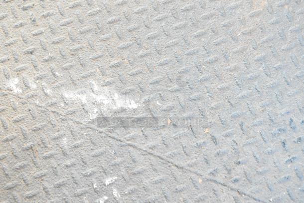 Southern Dimensions shell food trailer interior with textured metal flooring, ready for equipment installation. Clear title included.