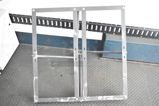 Metal frame component of a Southern Dimensions Shell Food Trailer, ready for equipment installation. In excellent condition.