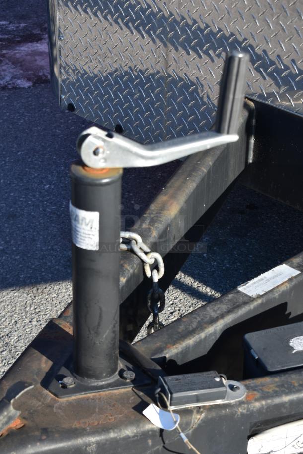 ATX 28' cold food & beverage trailer hitch detail, showing sturdy construction and attached safety chain.
