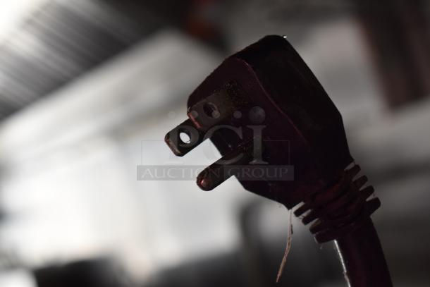 Close-up image of a power plug from ATX's new 2020 28' cold food trailer, featuring commercial-grade kitchen equipment.