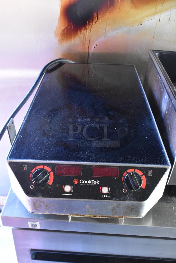 CookTek induction cooktop with digital controls, moderate wear, part of a fully equipped ATX 28' trailer for sale.