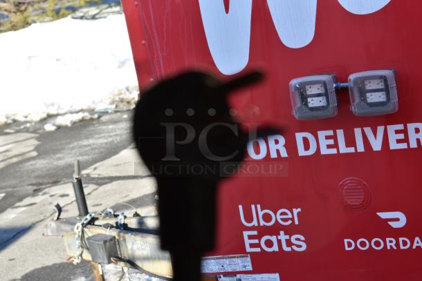 Red cold food and beverage trailer with delivery service logos, suitable for ghost kitchen setup. Features visible include dual electrical boxes.