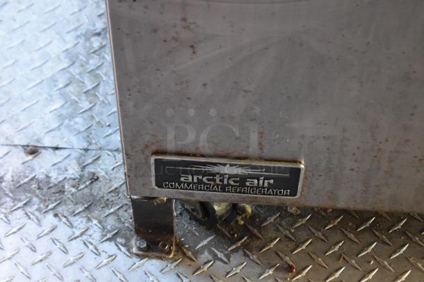 Arctic Air commercial refrigerator label on a metal surface, indicating part of the equipment in the ATX trailer.