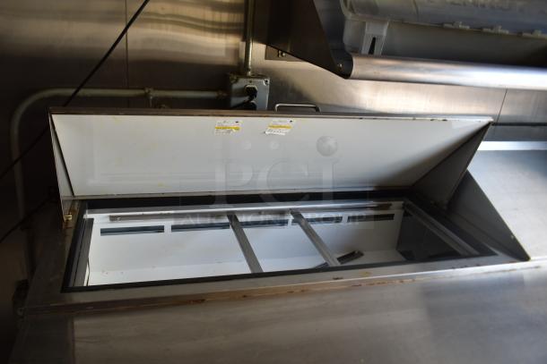 ATX 28' food trailer interior showing open Arctic Air prep table with stainless steel finish, well-equipped for commercial use.