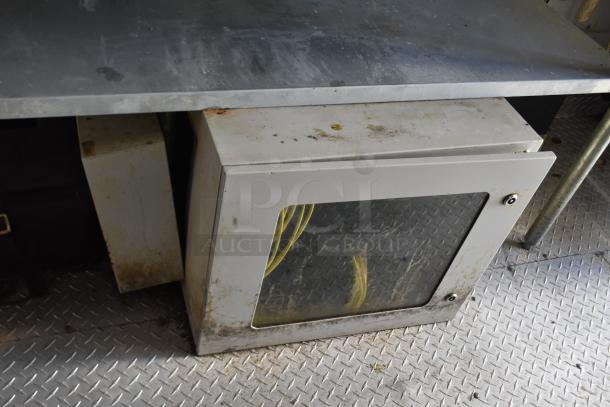 Interior view of a fully outfitted ATX 28' food and beverage retail trailer, showing equipment and stainless steel surfaces.