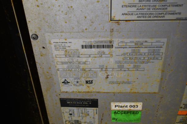 Label on food trailer component showing details: Pitco Friolator, model SG14R, 122000 BTU/hr, NSF certified.