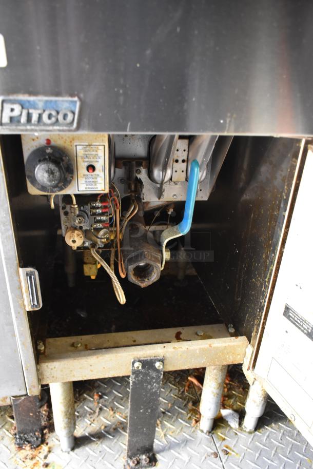 Pitco fryer interior in ATX 28' trailer, showcasing wiring and components. Ideal for ghost kitchen setup.