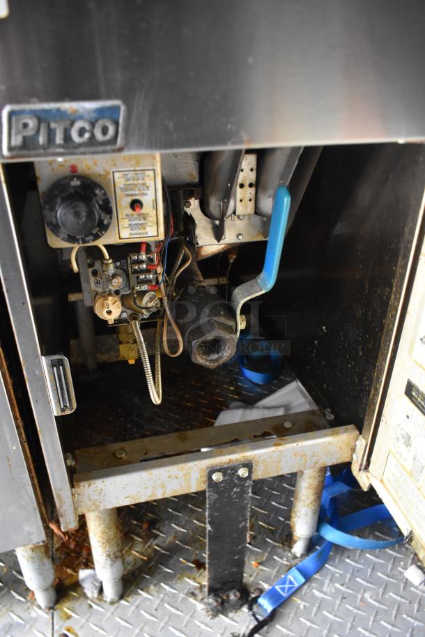 ATX 28' unbranded food trailer with Pitco fryer system, showcasing internal components. Suitable for commercial use.