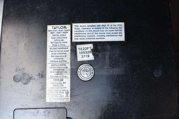 Labels and markings on a device indicating it complies with FCC rules, not legal for trade, manufactured by Taylor.