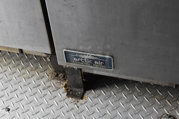 Arctic Air commercial freezer in an ATX 28' food trailer. Steel construction with visible brand label.
