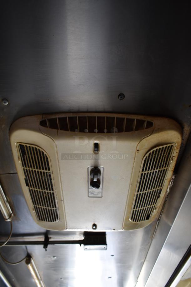 Interior view of ATX 28' cold food trailer showing ceiling ventilation. Features Arctic Air equipment and suppression system.