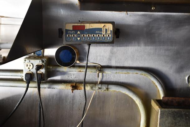 ATX 28' trailer control panel showing connections and outlet. Features industrial wiring and FMP control system.