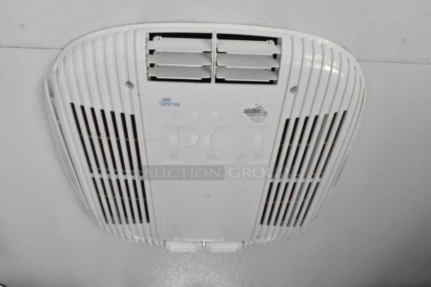 Ceiling mounted air vent in a food and beverage trailer, labeled "BELAIR 3800." Clean and new condition.