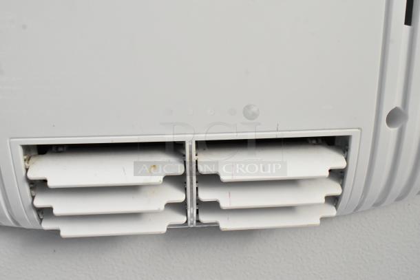Vent panel of the unbranded cold food and beverage trailer showing clean, white plastic louvers designed for efficient airflow.