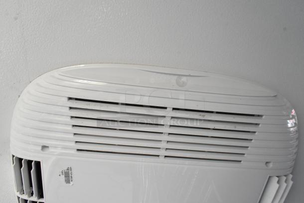 Air vent inside unbranded retail trailer. White housing with horizontal slats for ventilation. Part of outfitted equipment setup.