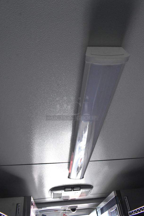 Ceiling of unbranded 2021 food/beverage trailer with modern lighting and visible air vent. Ideal for commercial use.