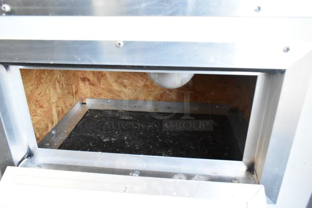 Interior view of a new 2021 cold food and beverage retail trailer. Features metal framing and durable paneling.