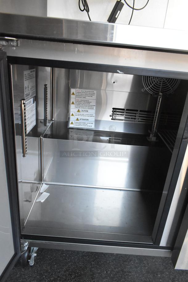 Unbranded food trailer with commercial-grade cooler interior. Visible caution labels. New condition, perfect for retail use.