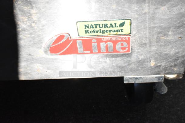 "eLine Refrigerator with Natural Refrigerant label on metal surface, indicating commercial-grade cooling equipment."