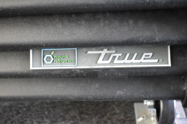 Auction item: New unbranded cold food trailer with True freezer, cooler, Turbo Air units, and sink. Features "Natural Refrigerant" label.