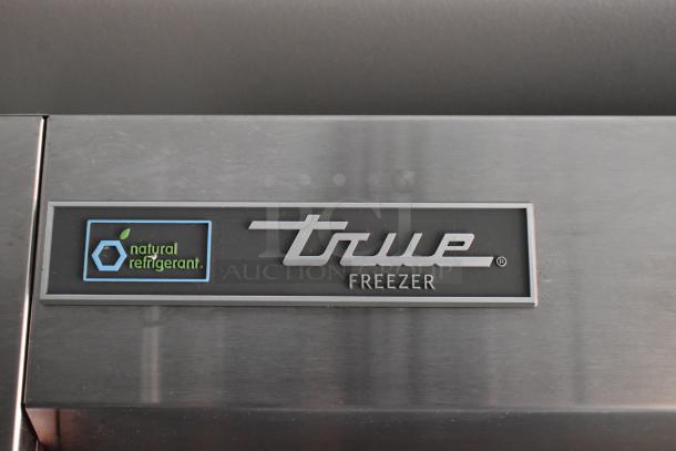 True Freezer label on a commercial-grade cold food and beverage trailer, equipped with natural refrigerant technology.