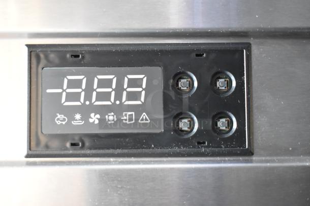 Digital control panel on an unbranded cold food and beverage trailer, showing temperature settings and operation buttons.