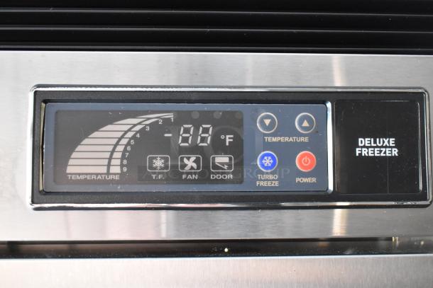 Close-up of Deluxe Freezer control panel displaying -18°F temperature with buttons for turbo freeze, fan, and door settings.
