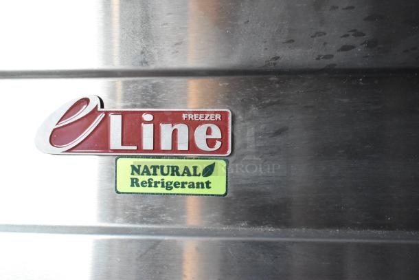 Close-up of eLine freezer label indicating use of natural refrigerant, featured in a fully equipped retail trailer.