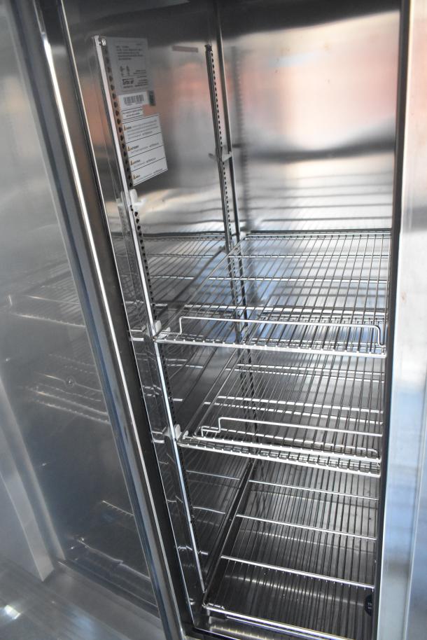 Interior of commercial-grade cold storage with wire shelving, part of unbranded 2021 food and beverage trailer. Tag: Turbo Air.