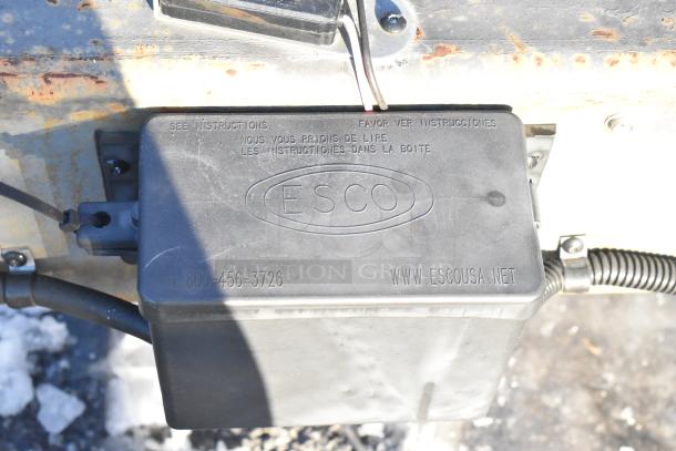 Close-up of ESCO branded electrical box on a Titanium Cargo 28' food trailer. Box includes contact info and website.