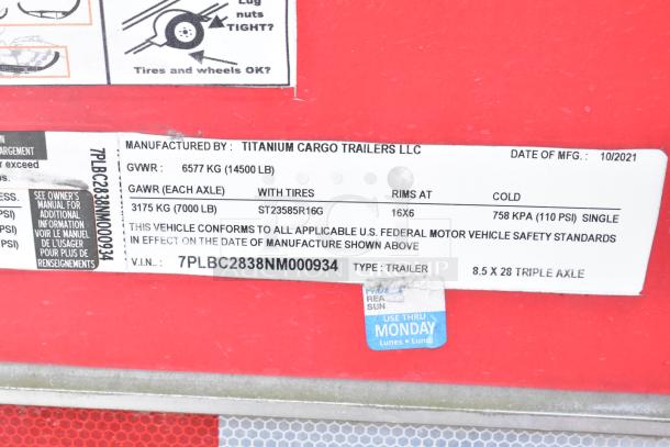 Label on a Titanium Cargo 28' shell food trailer, manufactured 10/2021. GVWR 6577 kg, GAWR 3175 kg. Triple axle type.