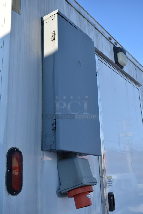 Brand new 2021 Nationwide 24' food trailer exterior, featuring electrical panel and connection. Clear title included.