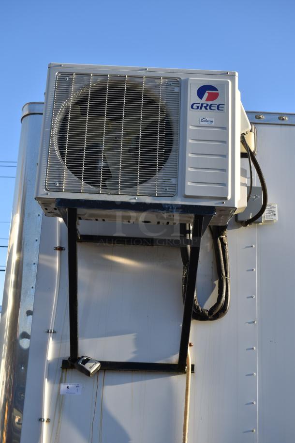 Exterior view of a Nationwide 24' Shell Food Trailer featuring a mounted Gree air conditioning system. New condition.