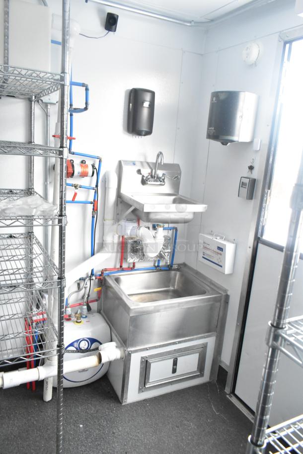 Cold Food & Beverage/Retail Trailer interior with sink stations, piped fittings, metal shelving, and appliance hookups.