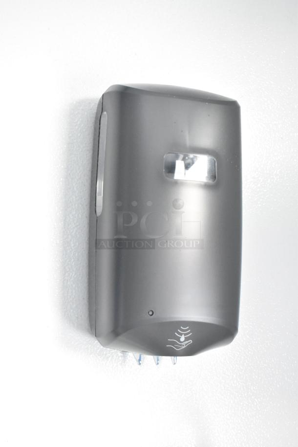 Wall-mounted automatic soap dispenser with a sensor and drip symbol on a textured white surface.