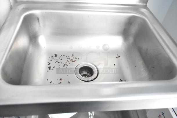 Stainless steel sink with rust spots, part of a fully outfitted food trailer. Includes Turbo Air Coolers and other equipment.