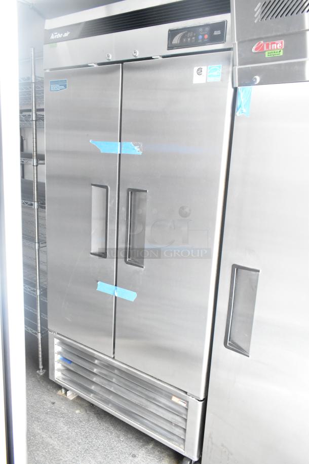 Unbranded cold food and beverage trailer interior showing Turbo Air cooler and freezer. Commercial-grade, new condition.