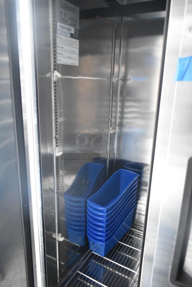 Inside view of an unbranded cold food trailer showing commercial-grade Turbo Air cooler with blue trays. Clean and ready for use.