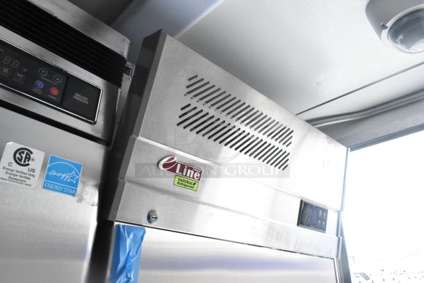 Interior view of a cold food and beverage trailer showing commercial-grade equipment, including eLine Natural Refrigerant unit, Energy Star certified.