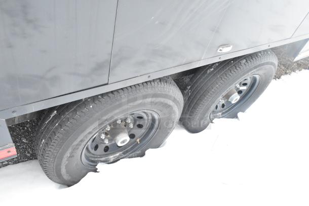 Cold food & beverage trailer wheels on snowy ground, showing dual axle setup. Ideal for diverse service concepts.