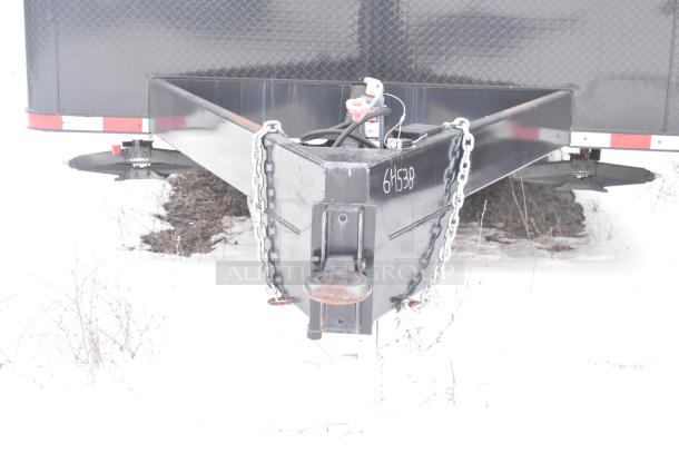 Unbranded cold food and retail trailer hitch detail, showing black metal, attached chains, and the marking "6H538."