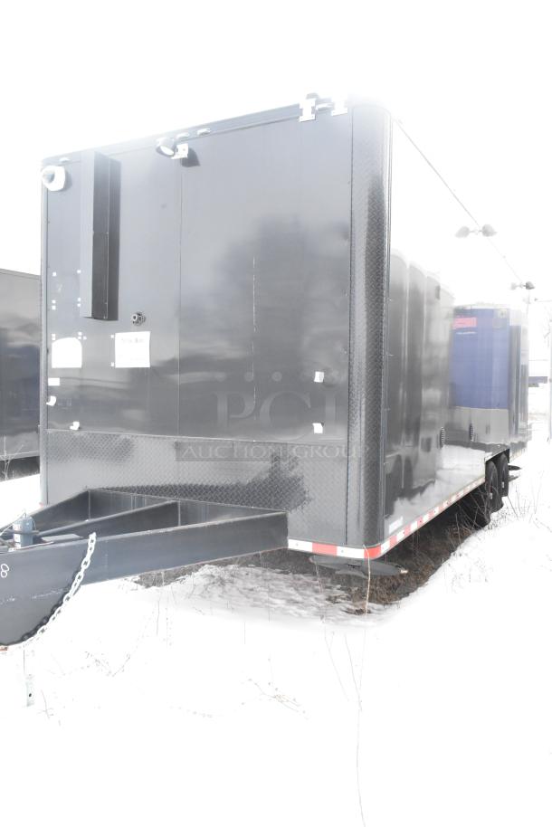 Black unbranded food and retail trailer, 2021 model, equipped with Turbo Air, True Coolers, sinks, POS system. Clear title.