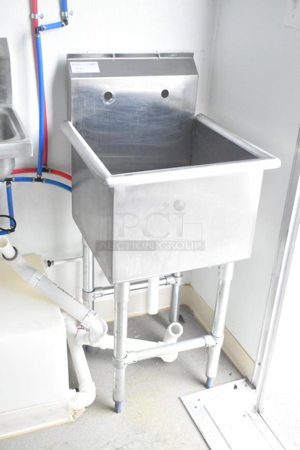 Nationwide 24' shell food trailer interior with stainless steel sinks, new plumbing, Gree AC, and shelving. Clear title included.