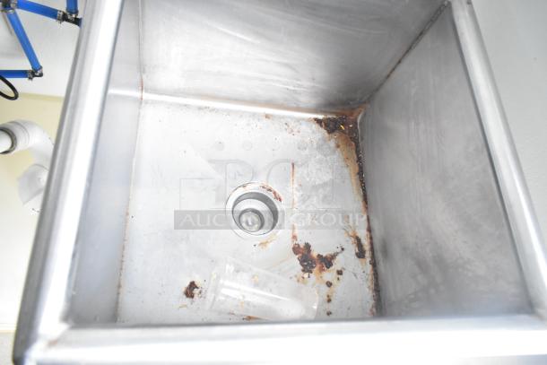 Stainless steel sink with visible rust and sediment in a 2021 Nationwide 24' Shell Food Trailer.