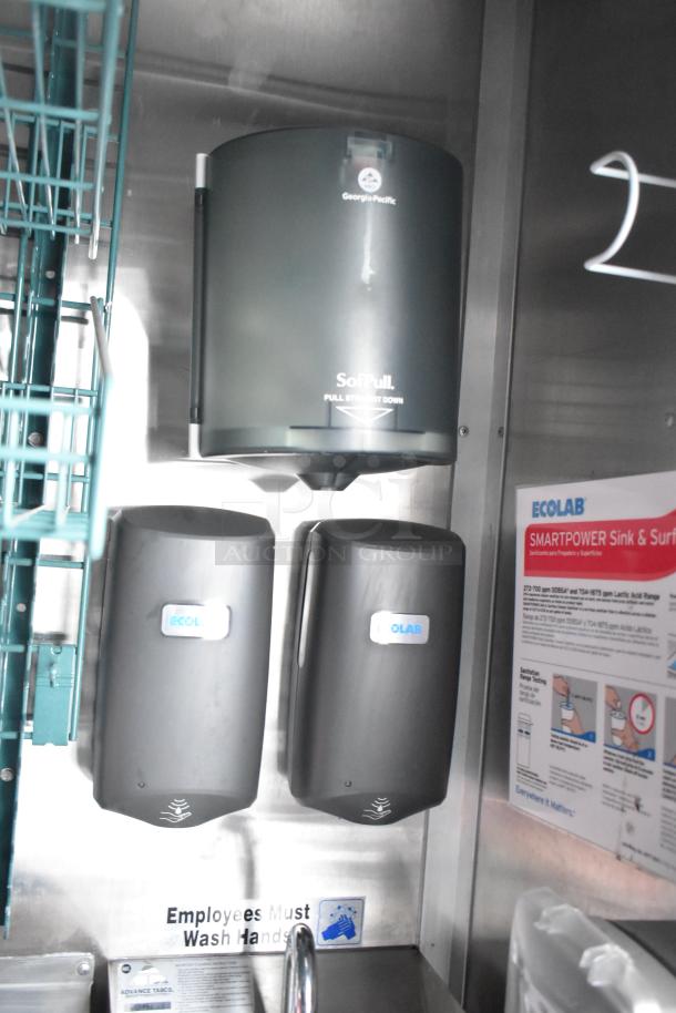 Interior view of a Titanium Cargo 28' shell food trailer, featuring a Georgia-Pacific SoftPull dispenser, Ecolab soap dispensers, and sink area with hygiene signage, emphasizing readiness for custom mobile kitchen setup.