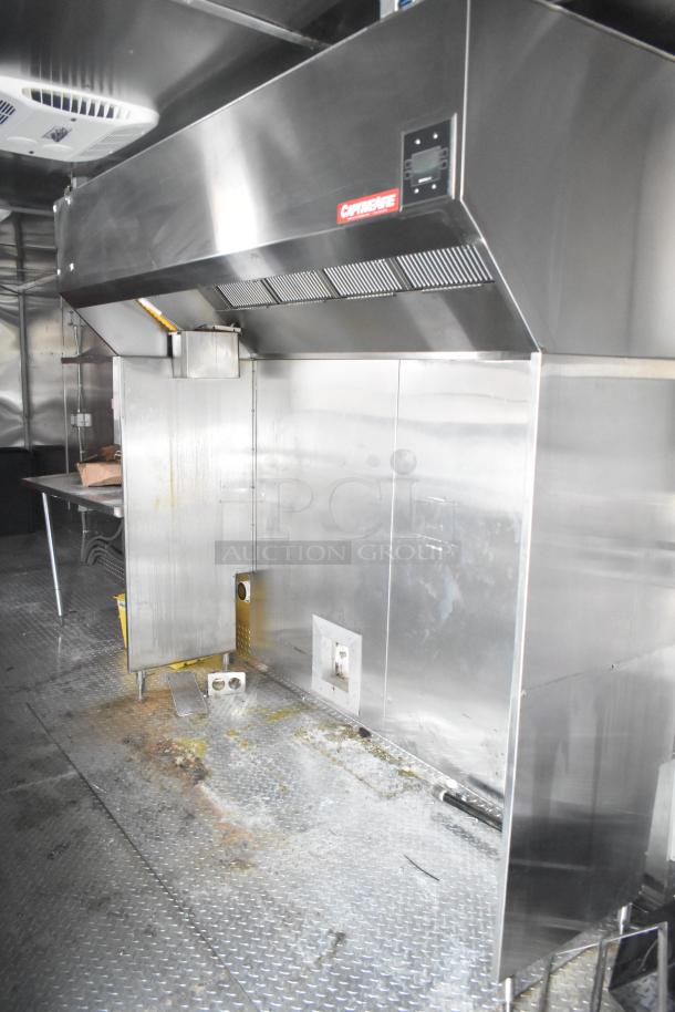 Titanium Cargo 28' food trailer interior with CaptiveAire grease hood, sinks, shelves, and security system. Brand new, 2021.