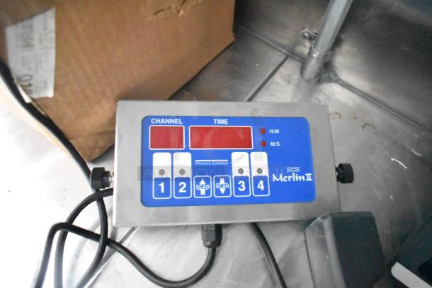 Control panel inside a 2021 Titanium Cargo 28' food trailer, featuring a Merlin II timer for custom kitchen setup.