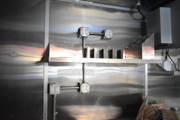 Brand new 2021 Titanium Cargo 28' food trailer, featuring grease hood, sinks, shelving, and security system. Ready for customization.