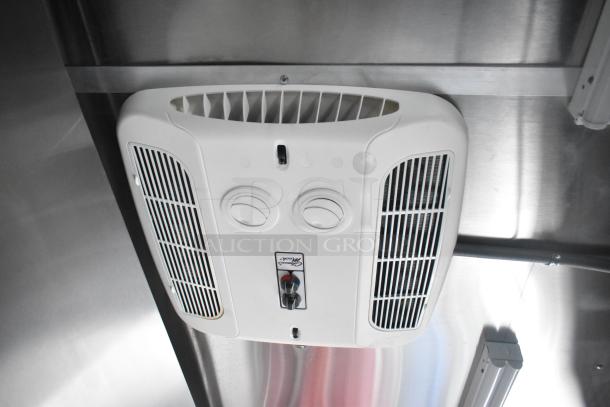 White roof vent in the 2021 Titanium Cargo 28' food trailer. Features adjustable air vents and integrated design for ventilation.