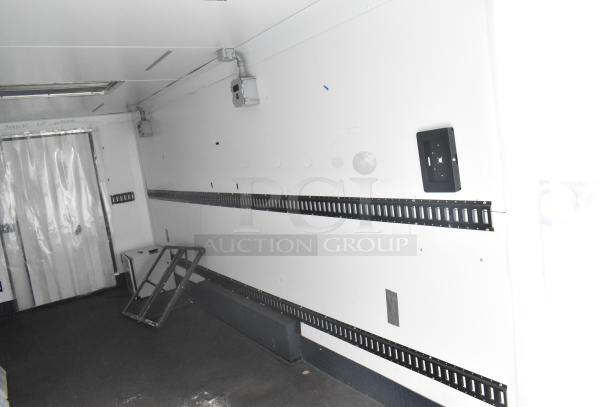 2020 Southern Dimensions 8.5' x 24' insulated trailer interior, white walls, metal rails, purpose-built as mobile walk-in cooler.